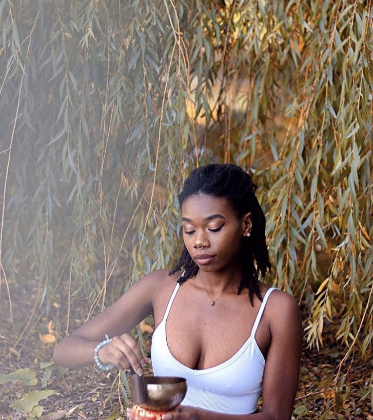 woman holding sound bowl 
