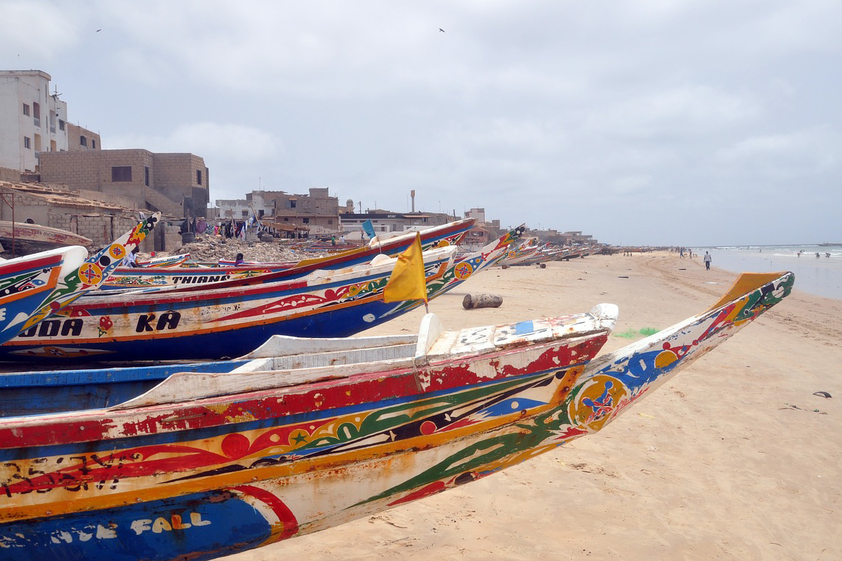 Senegal Beach with colorful painted boats