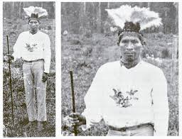 Antonio Saldaña in traditional Bri Bri attire holding his royal staff.