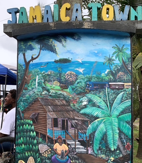 Man sitting on a sign 